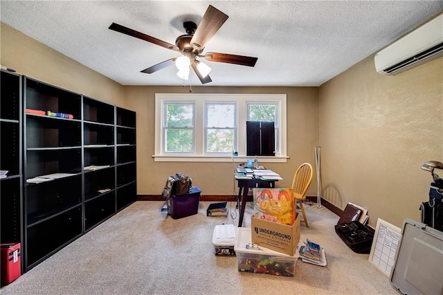 1002 S Olive St, Holden, MO 64040 - carpeted home office featuring a wall unit AC, a ceiling fan, and a textured ceiling
