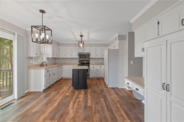320 SW Raven Ct, Lees Summit, MO 64081 - kitchen featuring white appliances, light countertops, a chandelier, dark wood-type flooring, and white cabinetry