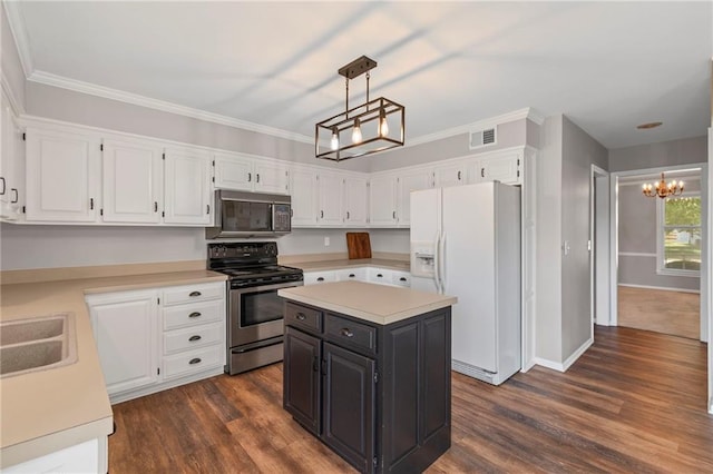 320 SW Raven Ct, Lees Summit, MO 64081 - kitchen with appliances with stainless steel finishes, a chandelier, white cabinets, light countertops, and dark wood-type flooring