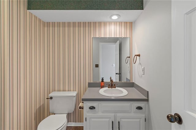 320 SW Raven Ct, Lees Summit, MO 64081 - half bathroom featuring vanity and wallpapered walls