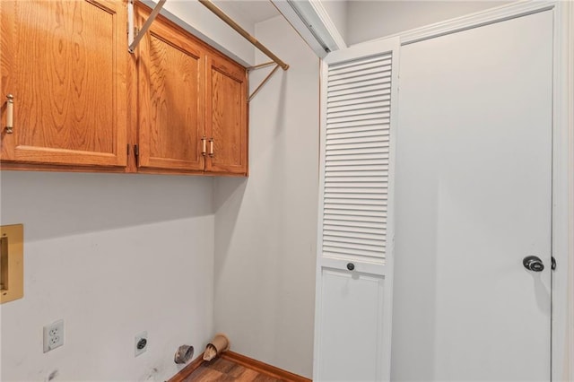 320 SW Raven Ct, Lees Summit, MO 64081 - laundry area with cabinet space, hookup for an electric dryer, and wood finished floors