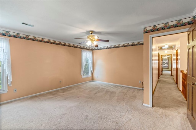320 SW Raven Ct, Lees Summit, MO 64081 - spare room featuring light colored carpet, a ceiling fan, and crown molding