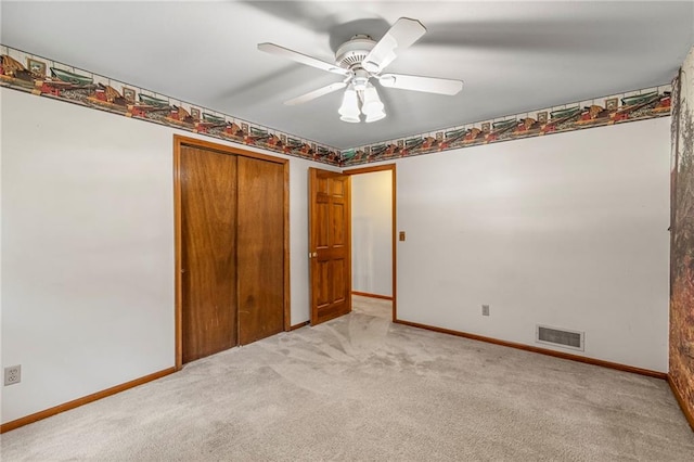 320 SW Raven Ct, Lees Summit, MO 64081 - unfurnished bedroom with light colored carpet, a closet, and a ceiling fan