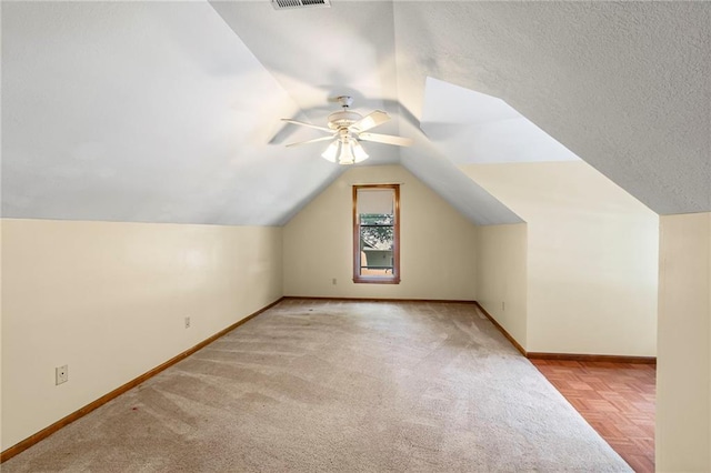 320 SW Raven Ct, Lees Summit, MO 64081 - bonus room featuring ceiling fan, vaulted ceiling, and carpet