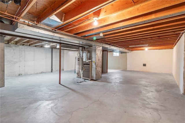 320 SW Raven Ct, Lees Summit, MO 64081 - unfinished below grade area featuring water heater and heating unit