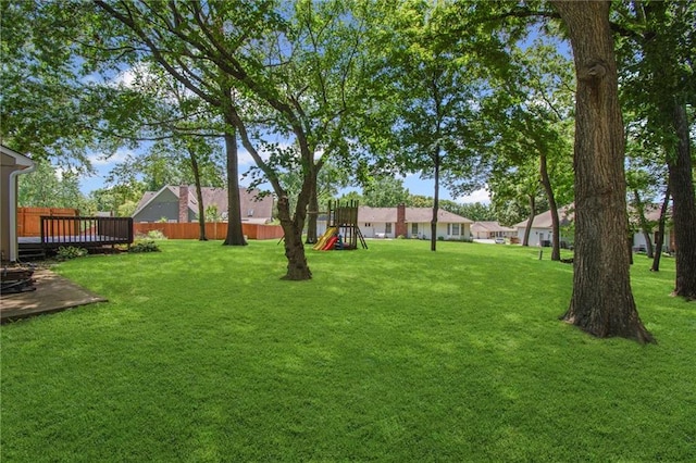 320 SW Raven Ct, Lees Summit, MO 64081 - view of yard with a playground and a wooden deck