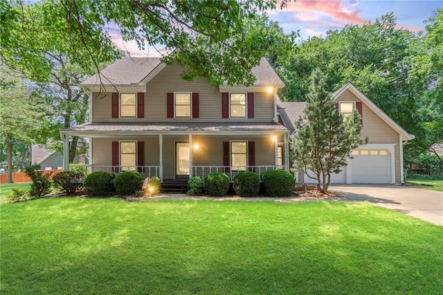 320 SW Raven Ct, Lees Summit, MO 64081 - view of front of property with driveway, a lawn, a porch, an attached garage, and roof with shingles