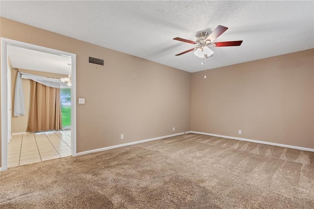 602 N Westview Dr, Richmond, MO 64085 - spare room featuring light carpet, a ceiling fan, a textured ceiling, and a chandelier