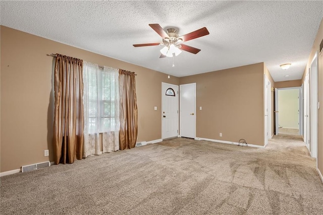 602 N Westview Dr, Richmond, MO 64085 - unfurnished room featuring a ceiling fan, carpet floors, and a textured ceiling