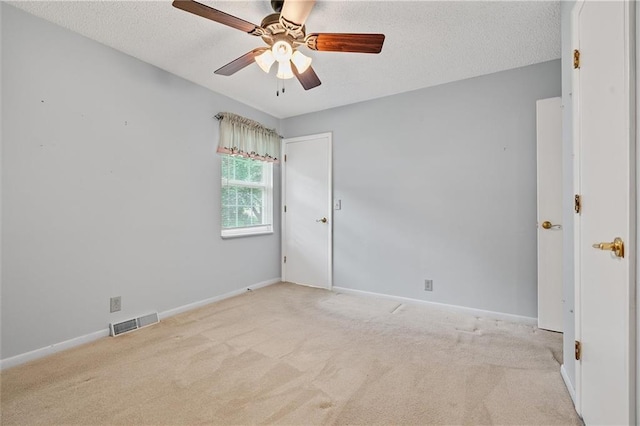 602 N Westview Dr, Richmond, MO 64085 - unfurnished room with carpet, ceiling fan, and a textured ceiling