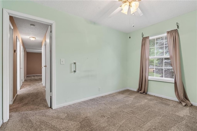 602 N Westview Dr, Richmond, MO 64085 - carpeted spare room with a textured ceiling, a ceiling fan, and a smoke detector
