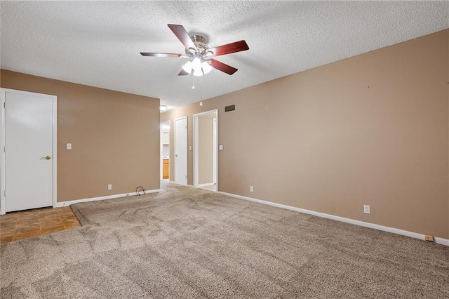 602 N Westview Dr, Richmond, MO 64085 - spare room with a ceiling fan, carpet, and a textured ceiling