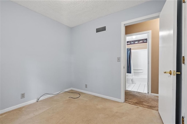 602 N Westview Dr, Richmond, MO 64085 - carpeted empty room with baseboards and a textured ceiling