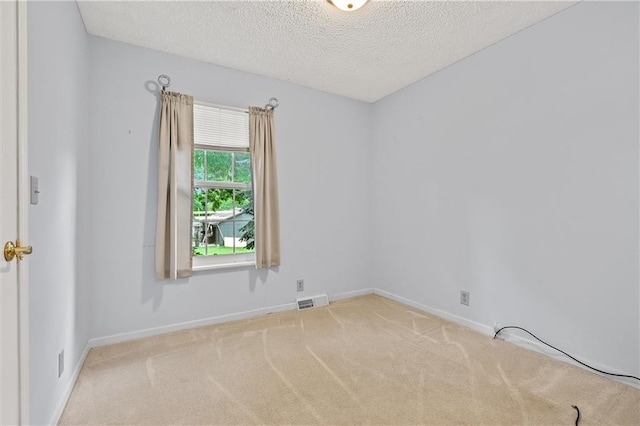 602 N Westview Dr, Richmond, MO 64085 - carpeted spare room with a textured ceiling and baseboards