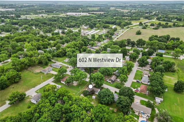 602 N Westview Dr, Richmond, MO 64085 - aerial view of residential area with a tree filled landscape