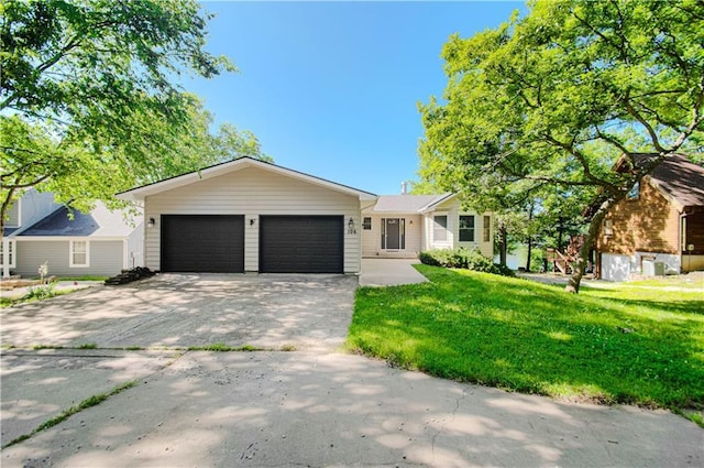 106 Timber Valley Dr, Linn Valley, KS 66040 - single story home with concrete driveway, a garage, and a front yard
