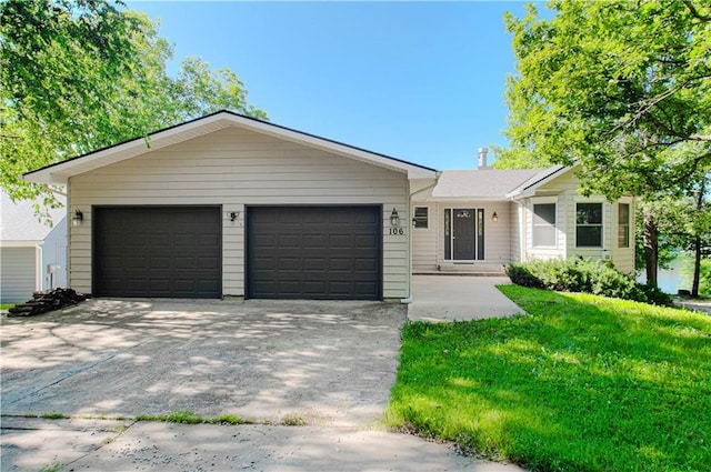 106 Timber Valley Dr, Linn Valley, KS 66040 - ranch-style home featuring concrete driveway, an attached garage, and a front yard