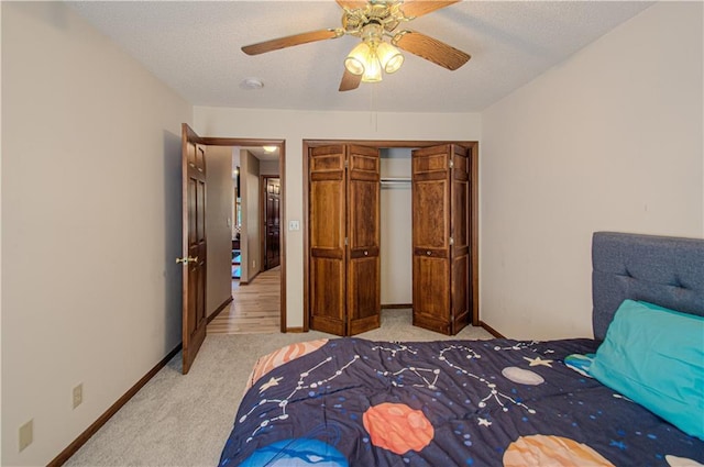 106 Timber Valley Dr, Linn Valley, KS 66040 - bedroom featuring light carpet, a closet, a ceiling fan, and a textured ceiling