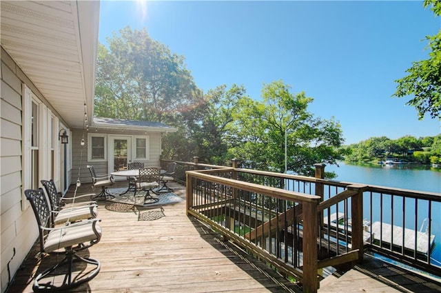 106 Timber Valley Dr, Linn Valley, KS 66040 - deck with a water view, outdoor dining area, and stairway