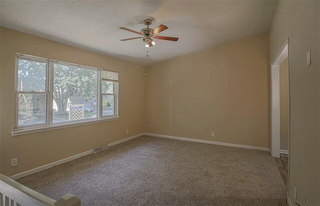 18205 E 27th St S, Independence, MO 64057 - carpeted empty room featuring a ceiling fan and baseboards