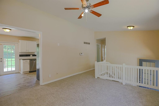 18205 E 27th St S, Independence, MO 64057 - spare room with light carpet, a ceiling fan, and vaulted ceiling