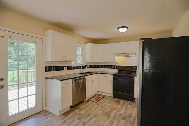 18205 E 27th St S, Independence, MO 64057 - kitchen with appliances with stainless steel finishes, under cabinet range hood, decorative backsplash, and white cabinets