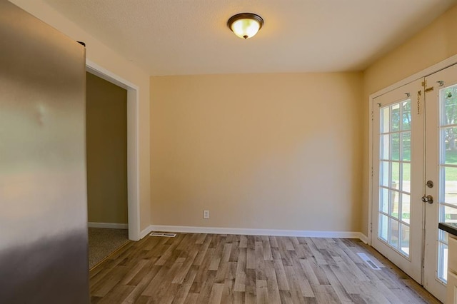 18205 E 27th St S, Independence, MO 64057 - empty room featuring wood finished floors and french doors