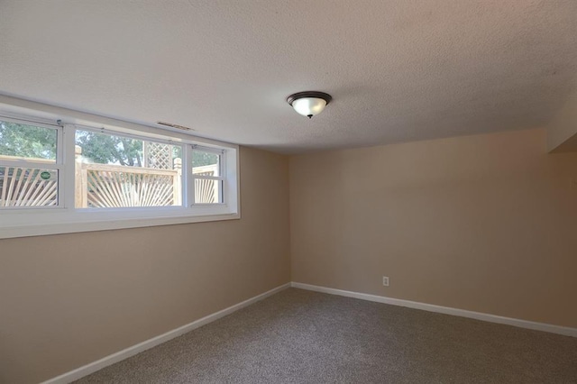 18205 E 27th St S, Independence, MO 64057 - carpeted spare room featuring a textured ceiling and baseboards