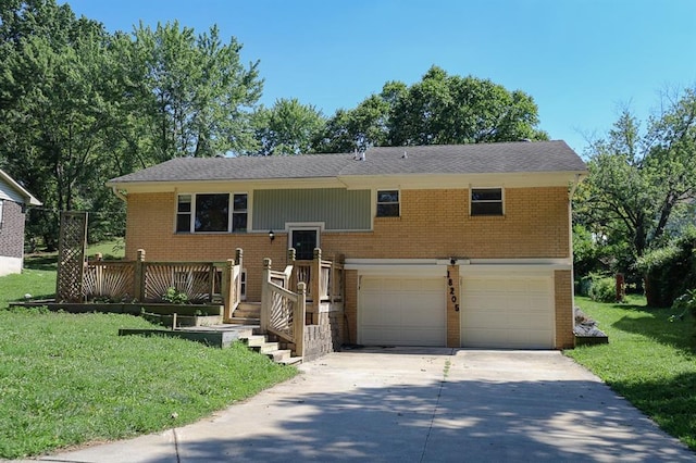 18205 E 27th St S, Independence, MO 64057 - bi-level home featuring brick siding, a garage, concrete driveway, and a front lawn