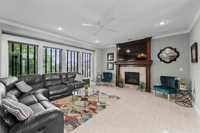16642 W 165th St, Olathe, KS 66062 - living area with a ceiling fan, a tiled fireplace, ornamental molding, and recessed lighting