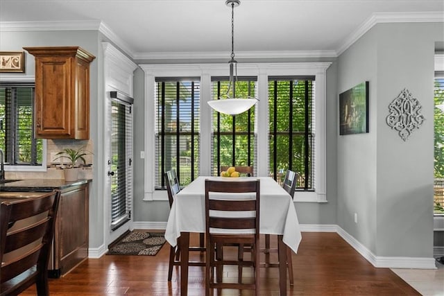 16642 W 165th St, Olathe, KS 66062 - dining room with dark wood-style flooring and ornamental molding