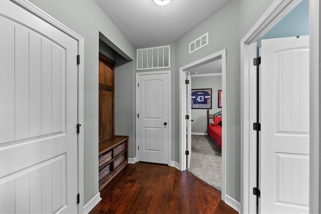 16642 W 165th St, Olathe, KS 66062 - mudroom featuring dark wood-style floors and a textured ceiling