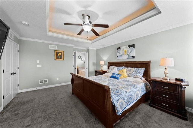 16642 W 165th St, Olathe, KS 66062 - bedroom featuring a raised ceiling, dark carpet, ornamental molding, and ceiling fan