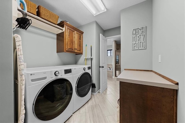 16642 W 165th St, Olathe, KS 66062 - washroom with cabinet space and washing machine and clothes dryer