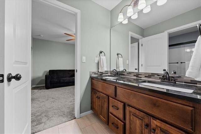 16642 W 165th St, Olathe, KS 66062 - bathroom featuring double vanity and baseboards
