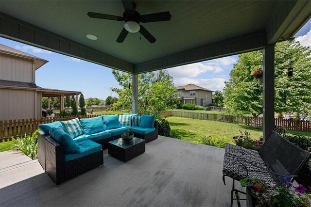 16642 W 165th St, Olathe, KS 66062 - fenced backyard featuring a patio area, ceiling fan, and outdoor lounge area