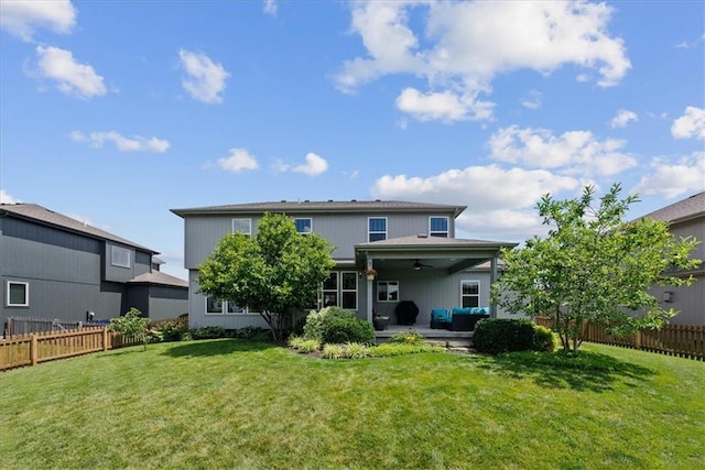 16642 W 165th St, Olathe, KS 66062 - rear view of property with ceiling fan, an outdoor living space, a fenced backyard, and a patio