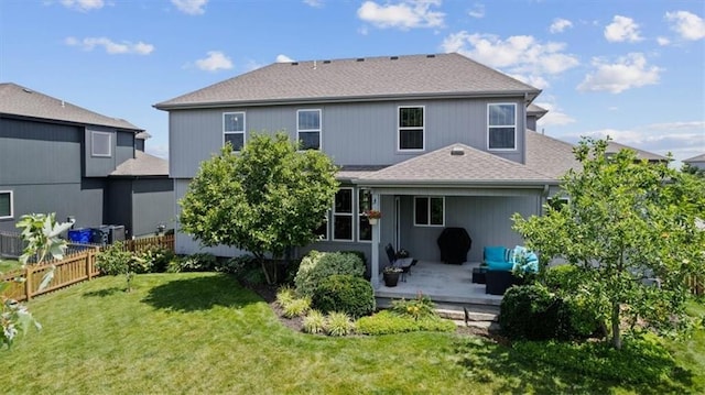 16642 W 165th St, Olathe, KS 66062 - back of property with roof with shingles and a patio area