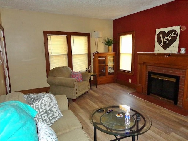 1915 S Elm St, Pittsburg, KS 66762 - living area featuring wood finished floors and a brick fireplace