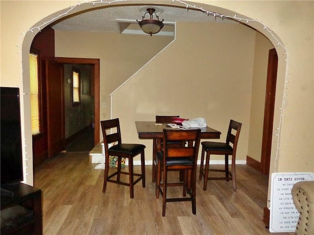 1915 S Elm St, Pittsburg, KS 66762 - dining space featuring arched walkways and wood finished floors