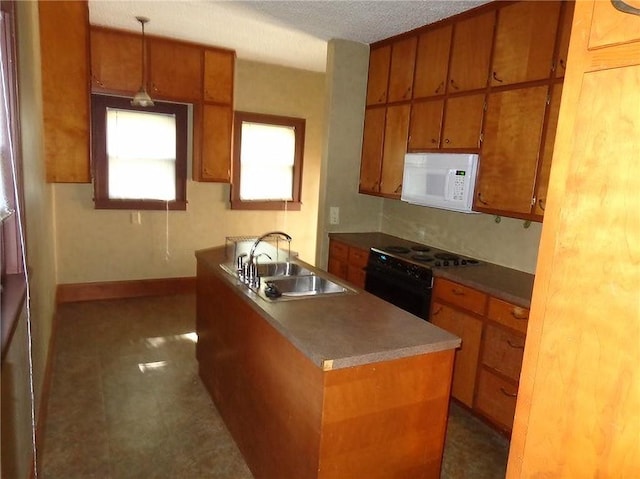 1915 S Elm St, Pittsburg, KS 66762 - kitchen with white microwave, black range with electric stovetop, brown cabinetry, and a textured ceiling