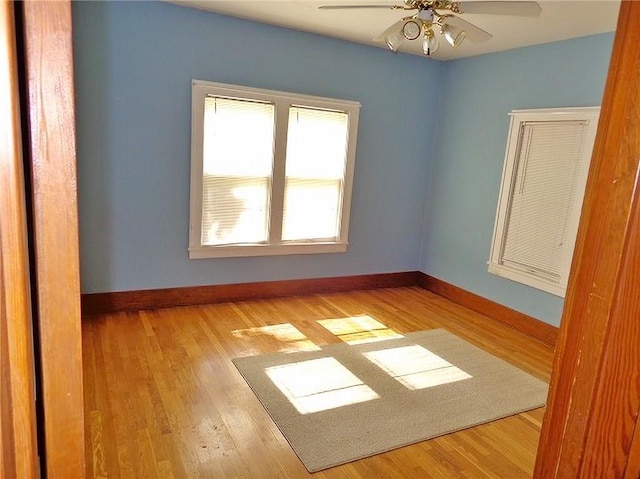 1915 S Elm St, Pittsburg, KS 66762 - empty room with ceiling fan and wood finished floors