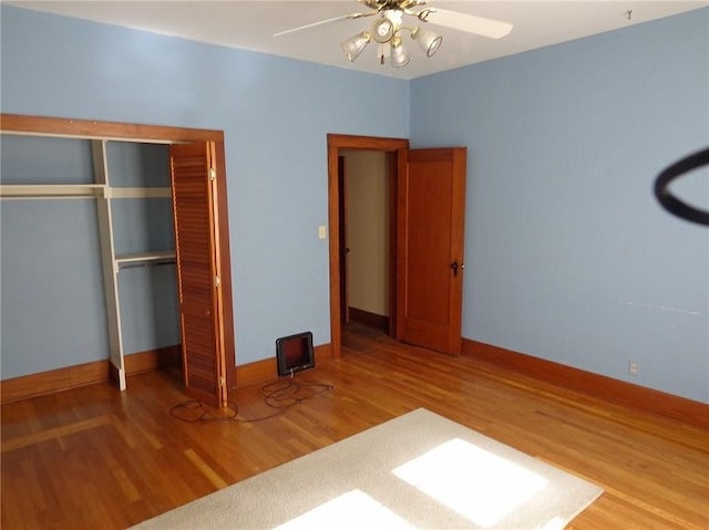 1915 S Elm St, Pittsburg, KS 66762 - unfurnished bedroom featuring wood finished floors, a closet, and a ceiling fan