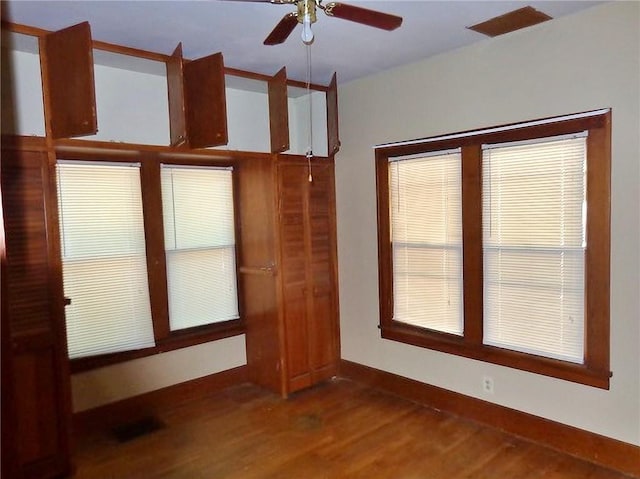 1915 S Elm St, Pittsburg, KS 66762 - empty room featuring a ceiling fan and wood finished floors