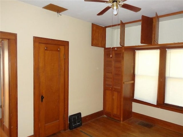 1915 S Elm St, Pittsburg, KS 66762 - unfurnished bedroom with wood finished floors and ceiling fan