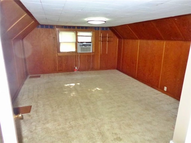 1915 S Elm St, Pittsburg, KS 66762 - additional living space featuring cooling unit, wooden walls, carpet floors, and vaulted ceiling