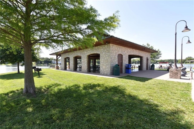 9305 NW 80th St, Weatherby Lake, MO 64152 - view of property's community featuring a lawn and a water view