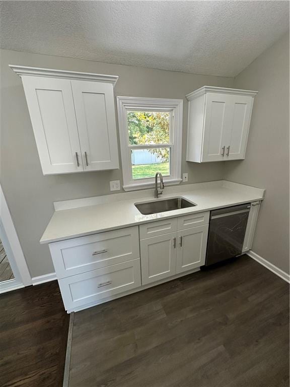 806 Lea Dr, Lees Summit, MO 64081 - kitchen featuring dishwasher, dark wood-style floors, light countertops, white cabinetry, and a textured ceiling
