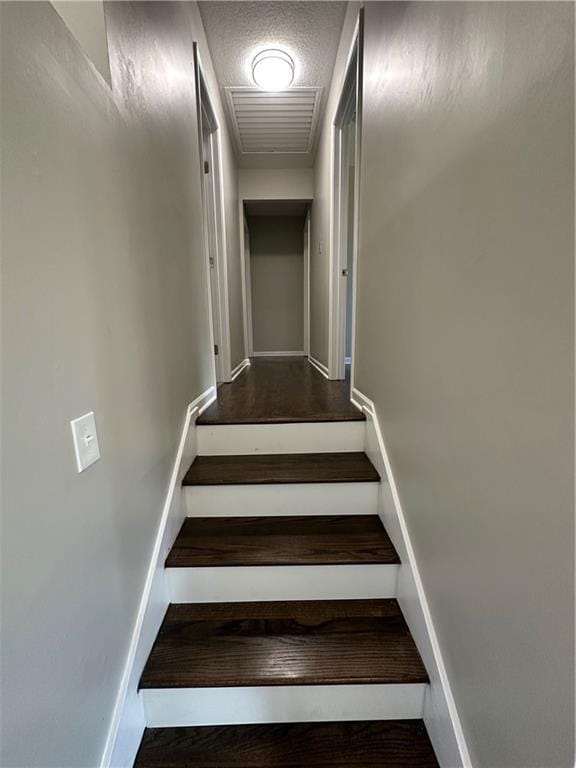 806 Lea Dr, Lees Summit, MO 64081 - stairway featuring baseboards and a textured ceiling