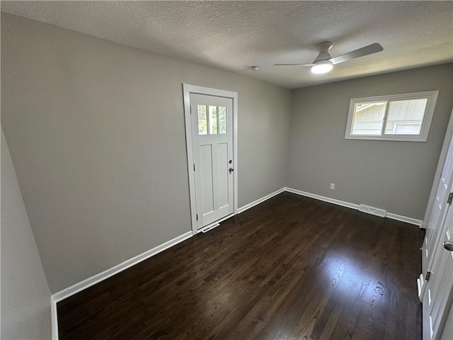 806 Lea Dr, Lees Summit, MO 64081 - entrance foyer with dark wood finished floors, a ceiling fan, and a textured ceiling